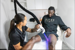 Professional cryotherapy massage treatment using controlled cooling technology for targeted muscle recovery.