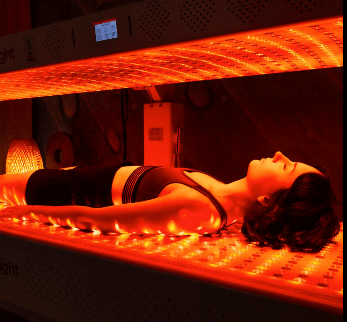 Professional full-body red light therapy bed providing non-invasive LED light treatment for wellness and relaxation.
