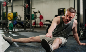 Athlete stretching after workout for muscle recovery