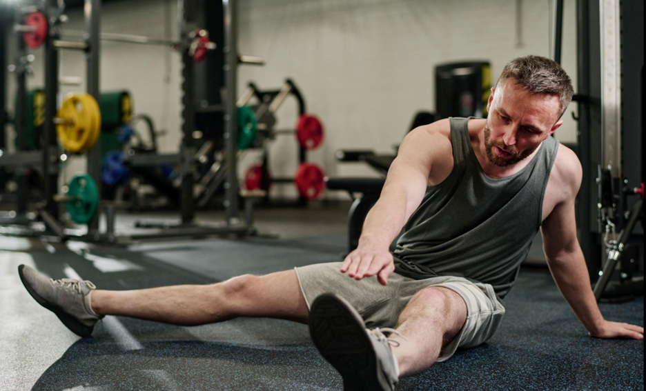 Athlete stretching after workout for muscle recovery
