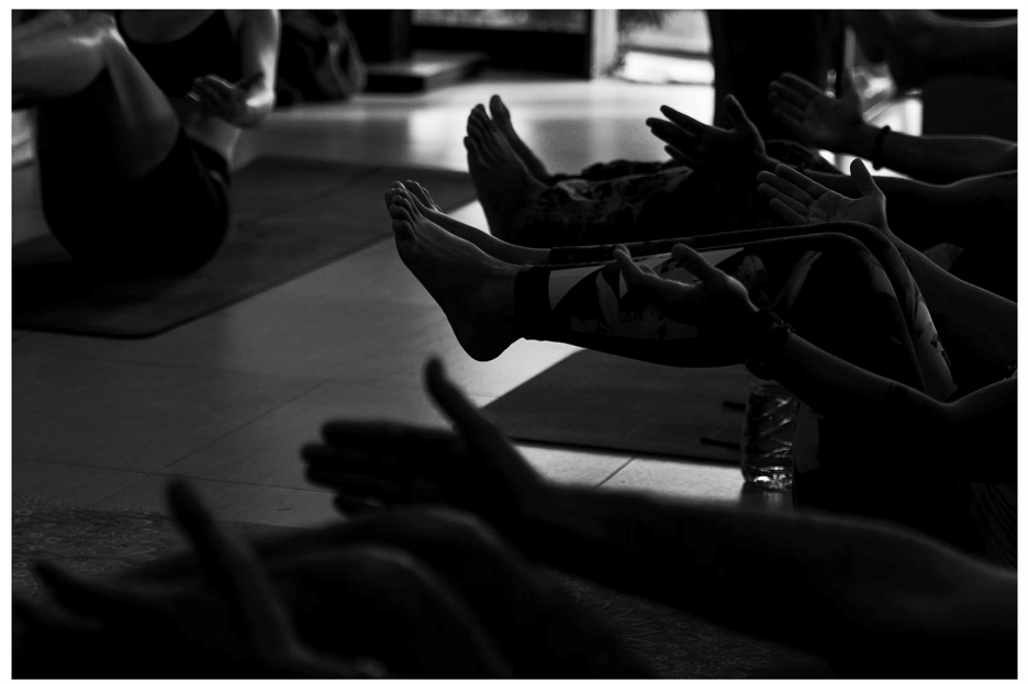 Group wellness session with participants using massage and recovery techniques